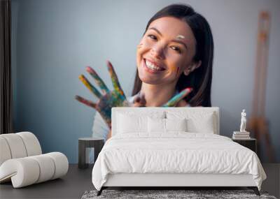 Joyful happy woman showing her hands to you Wall mural