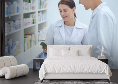 Man and woman in white coats with medicines Wall mural