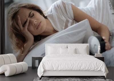 Sad tired woman waking up Wall mural