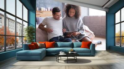 Sweet couple watching film together in a bedroom Wall mural