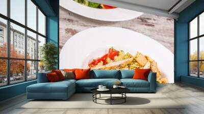 Top-view picture of two plates with vegetarian salads on the woo Wall mural