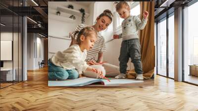 Woman and her kids involved in drawing Wall mural