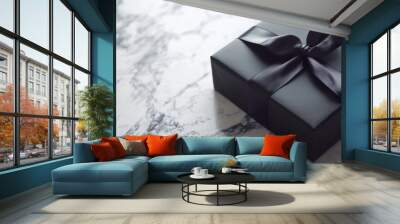 A minimalistic black gift box with a sleek black bow, exuding a sense of elegance and sophistication, perfect for presenting gifts in a stylish and modern way. Wall mural