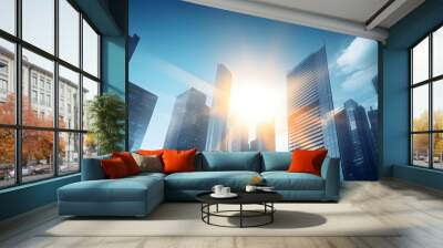 business and financial skyscraper buildings concept.Low angle view and lens flare of skyscrapers modern office building city in business center with blue sky. Wall mural