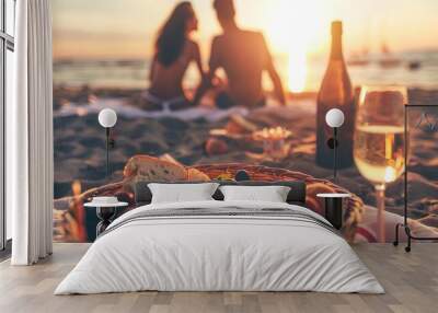 romantic couple in love doing picnic on the sea beach at sunset. blurred image of boyfriend and girl Wall mural