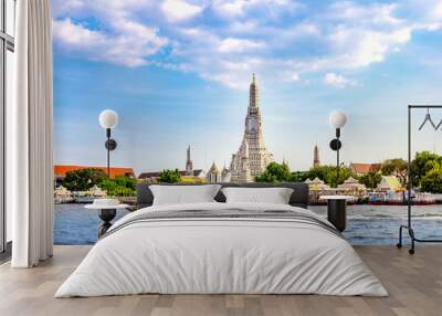 Wat Arun Temple with long tail boat in Bangkok Thailand. Wall mural