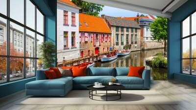 Historic medieval buildings with beautiful canal in the old town of Bruges (Brugge), Belgium Wall mural