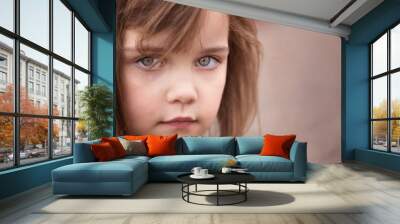 portrait of a little girl with big sad eyes Wall mural