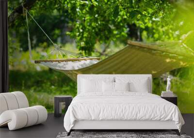 Summer garden with hanging hammock for relaxation Wall mural