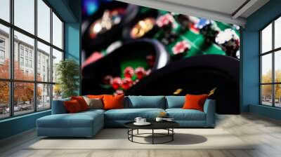 Casino theme, close up of roulette, red and black numbers, Stack of chips as background. Wall mural