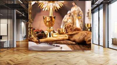 Catholic concept background.  The Cross, monstrance, Jesus figure, Holy Bible and golden chalice on the rustic wooden table. Wall mural