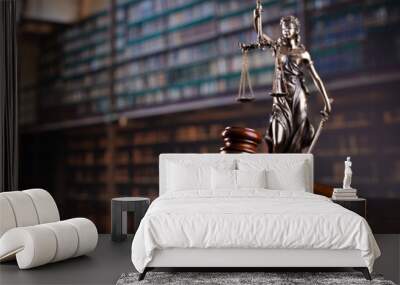 Law theme. Themis statue, scale and judge gavel in the law faculty library. Wall mural