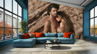 Beautiful boho style man and woman outdoors. sensual couple Wall mural