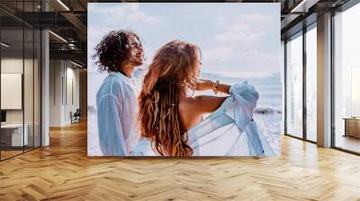 beautiful young cheerful couple on the beach Wall mural