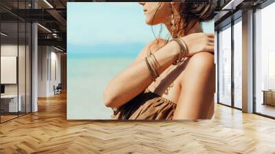 beautiful young woman in elegant dress on the beach close up Wall mural