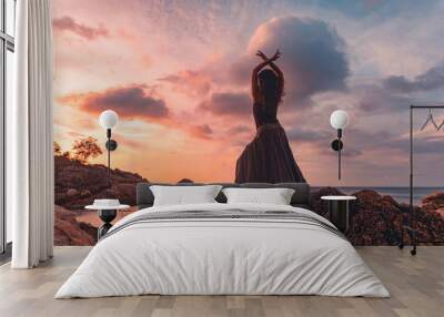 beautiful young woman silhouette on sunset Wall mural