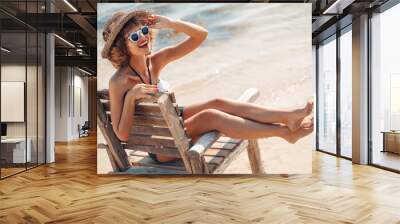 happy summer girl in 50s swimsuit on the beach Wall mural