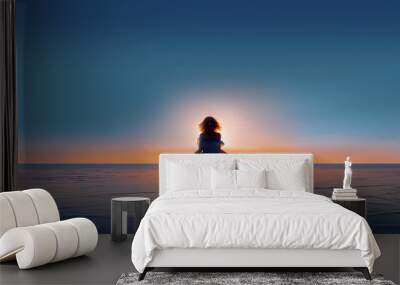 young woman silhouette walking on water at sunset Wall mural