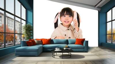 asian smiling little girl talking on the phone isolated on white Wall mural