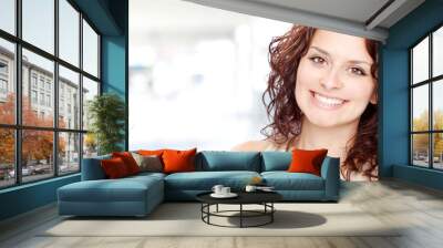 beautiful brunette girl smile portrait in a interior background Wall mural