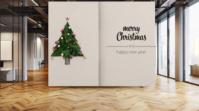 Merry Christmas and happy new year greetings in vertical top view cardboard with natural eco decorated christmas tree pine.Ecology concept.Xmas winter holiday season social media card background  Wall mural