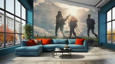 Three friends walk on mountain path in sunny day Wall mural