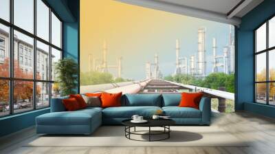 Industrial equipment and pipelines at the gas processing plant on a bright sunny summer day Wall mural