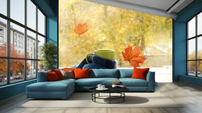 season when you need warm drinks/ green circle in the scarf, the window with maple leaves and drops after rain in autumn  Wall mural