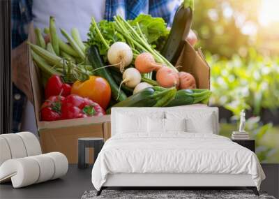 a close-up shot, a clean individual holds a cardboard box filled with incredibly fresh vegetables Wall mural