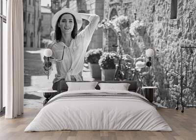 BW photography of a beautiful tourist woman. Italian holiday concept Wall mural