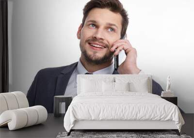 Close up of a laughing businessman on the phone isolated on whit Wall mural