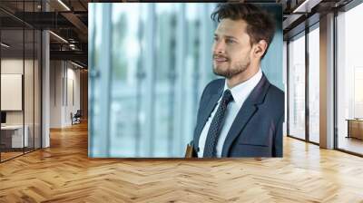 Handsome smiling confident businessman portrait Wall mural