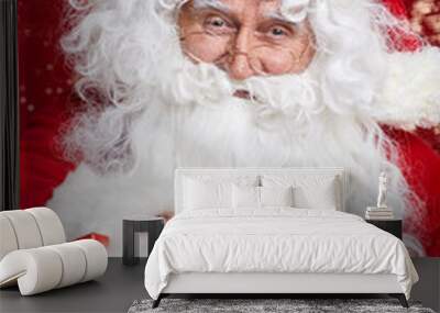 portrait of cheerful santa claus in christmas concept against r Wall mural