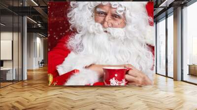 portrait of cheerful santa claus in christmas concept against r Wall mural