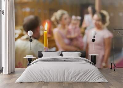 Burning candle at Orthodox christening with blurred background Wall mural