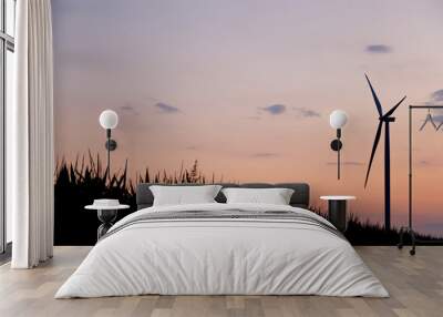 Windmill turbine silhouette at orange and red cloudy sunset sky Windmill turbine silhouette at orange and red cloudy sunset sky with corn field silhouette in front Wall mural