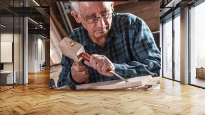 Senior carpenter working with his tools. Wall mural