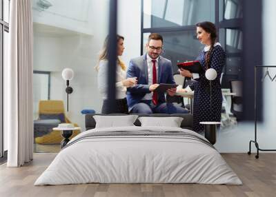 Business people having meeting in modern office Wall mural