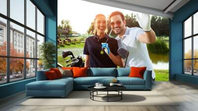 Happy couple feeling happy after golf game. - Image Wall mural