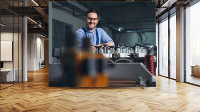 Mechanical engineer working on machines. Wall mural