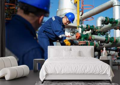 Two engineers working inside oil and gas refinery Wall mural