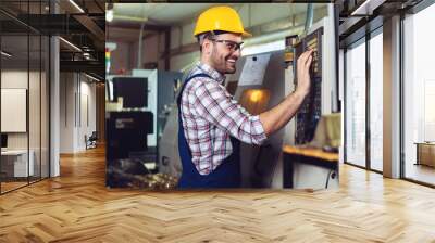 Worker operating CNC machine center Wall mural