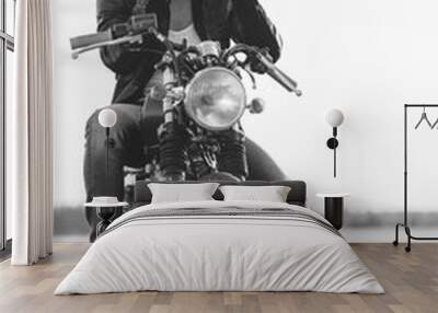 Young man in sunglasses and leather jacket sitting on motorbike  Wall mural