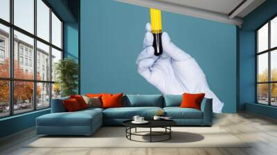 Blood plasma in vitro gloved hand holding Wall mural