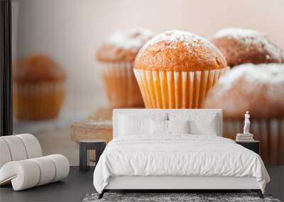 Tasty muffin closeup on a wooden board, selective focus. Wall mural