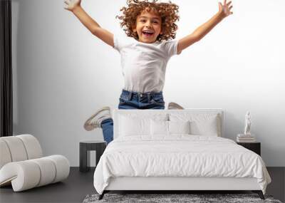 Joyful young child jumping high with excitement in bright indoor setting Wall mural