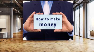 Business man hold paper how to make money text on it Wall mural