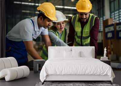 Group of Asian industrial worker has meeting to brainstorm and discuss at warehouse factory workplace. Industrial worker has planning and discussing scene. Auditor working onsite. Wall mural