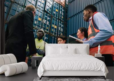 Shipping worker team update information together at the container yard as the background. shipment business teamwork. Professional team management and meeting. Wall mural