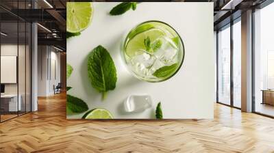 Delicious refreshing summer cocktail mojito with ice, white background,The glass of cocktail garnished with lemon and mint, cold drink in summer .
 Wall mural